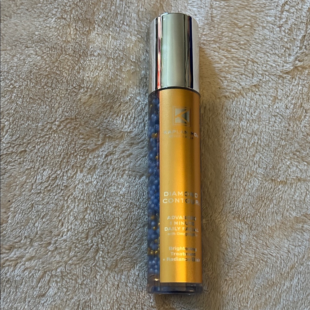 Kaplan MD Gold and Blue Skincare Bottle